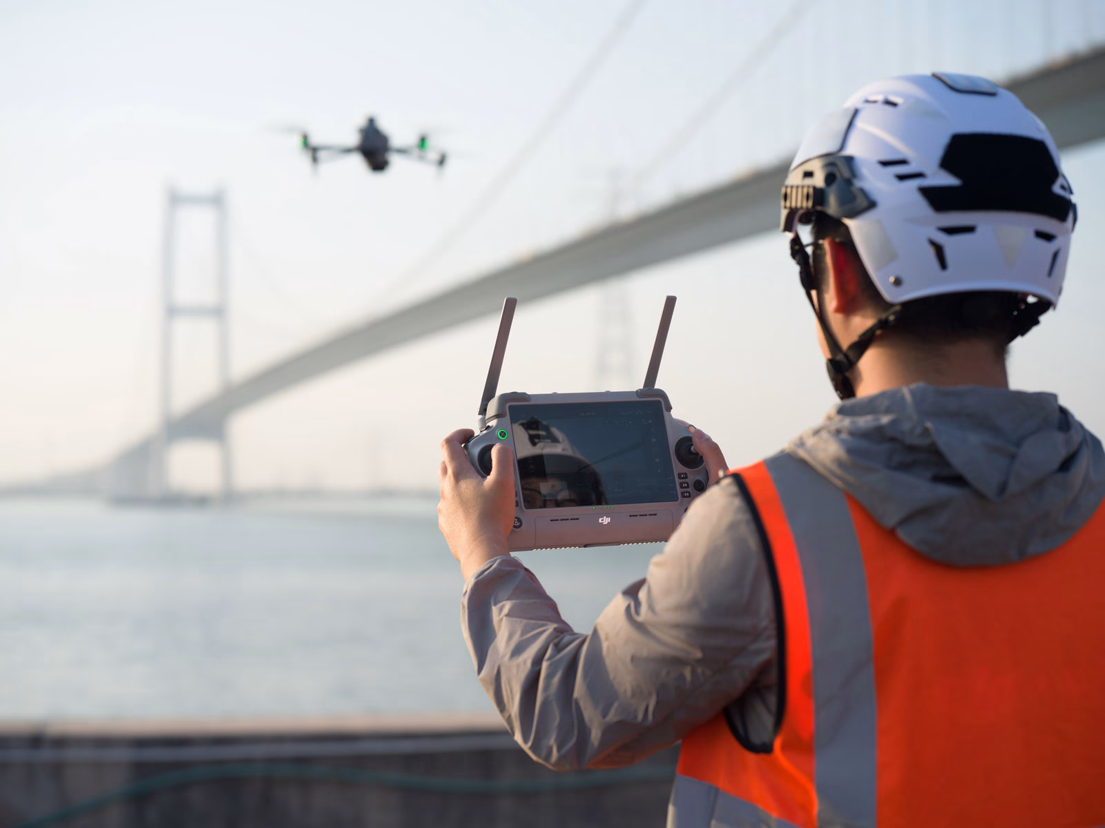 DJI Matrice 4 series drone used for inspection and survey work on a bridge