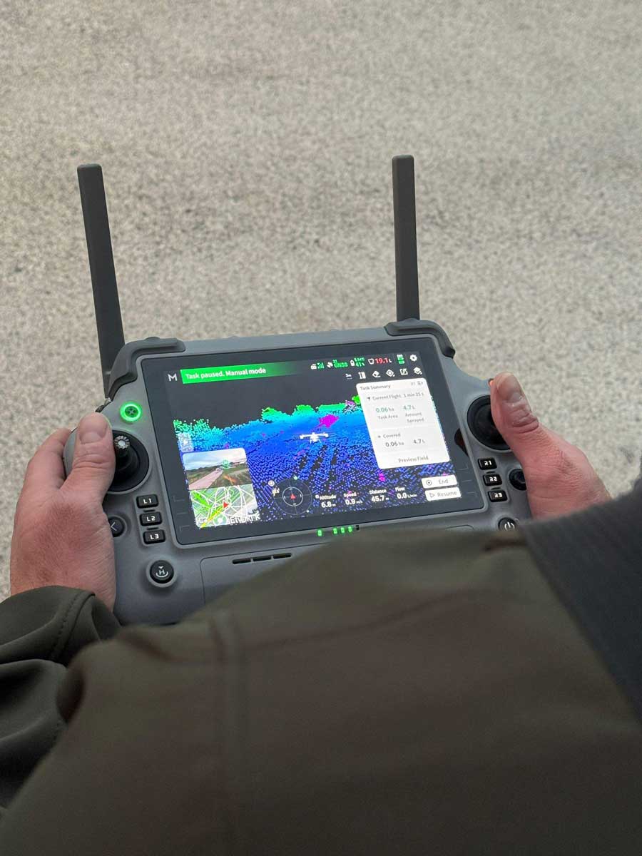 Close-up of an agricultural drone controller used for precision spraying missions