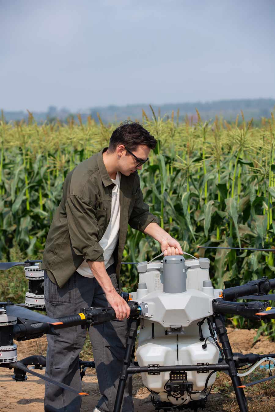 DJI Agras T100 spraying over UK arable crops